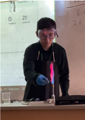 teacher conducting flame test lab